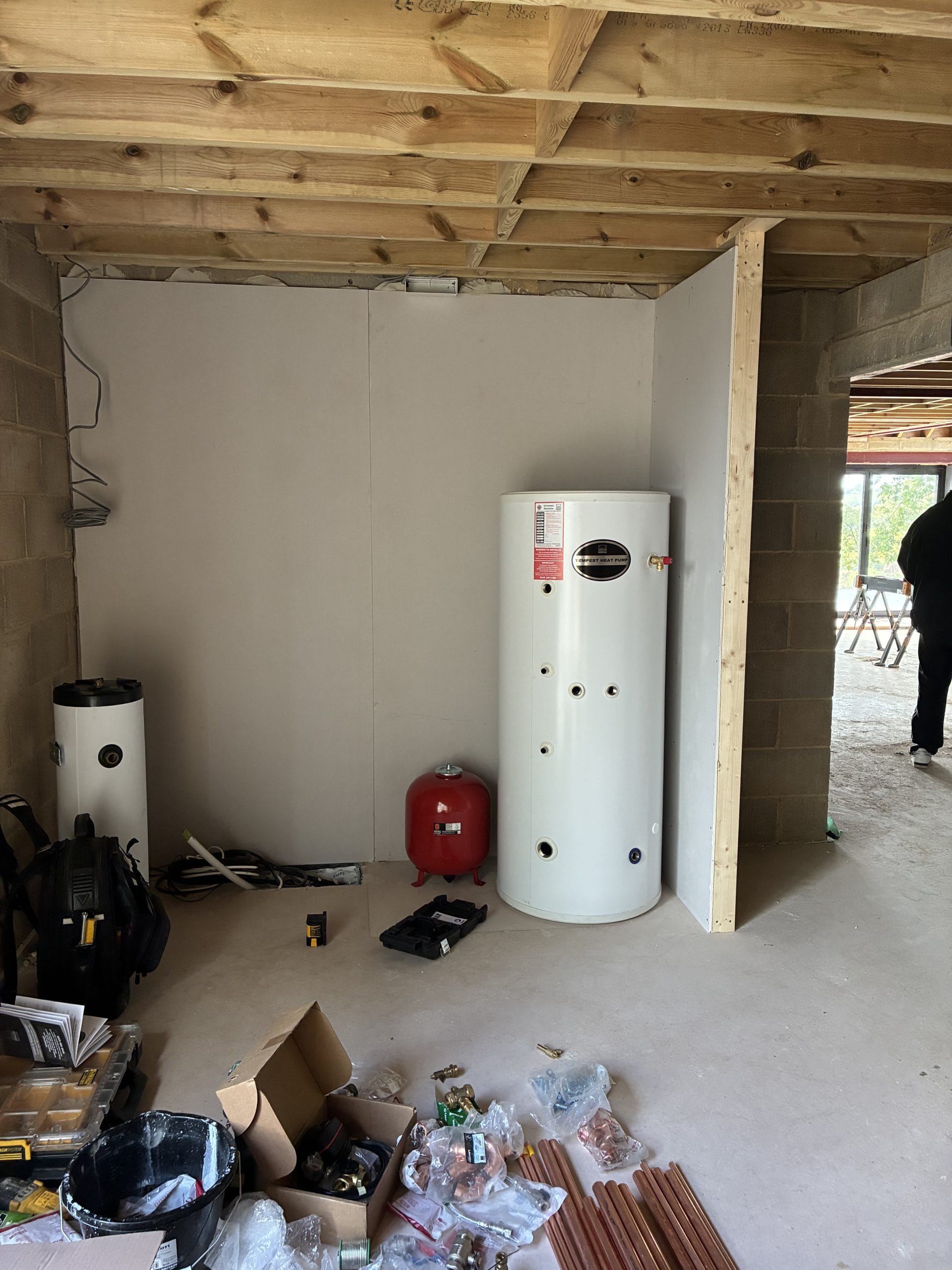 Front view of a Daikin air source heat pump installed at a new-build property in Hawkinge, Kent