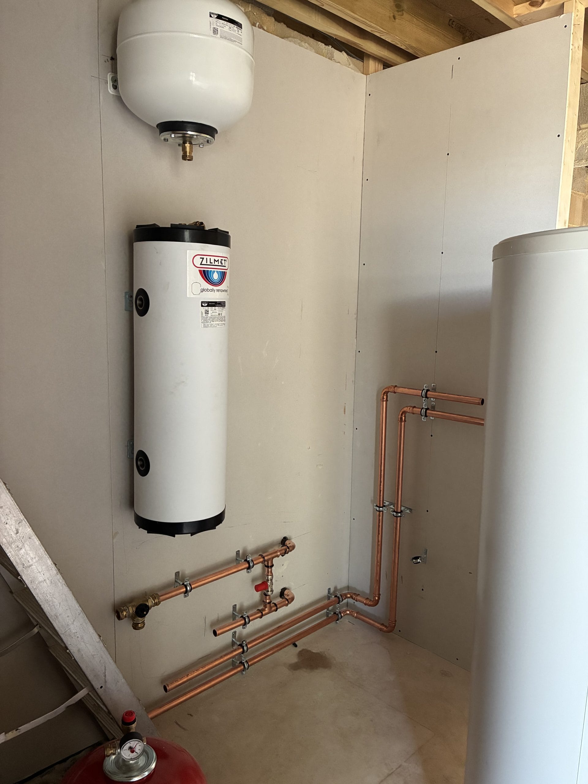 Daikin air source heat pump with external pipework and electrical isolators in Hawkinge near Folkestone