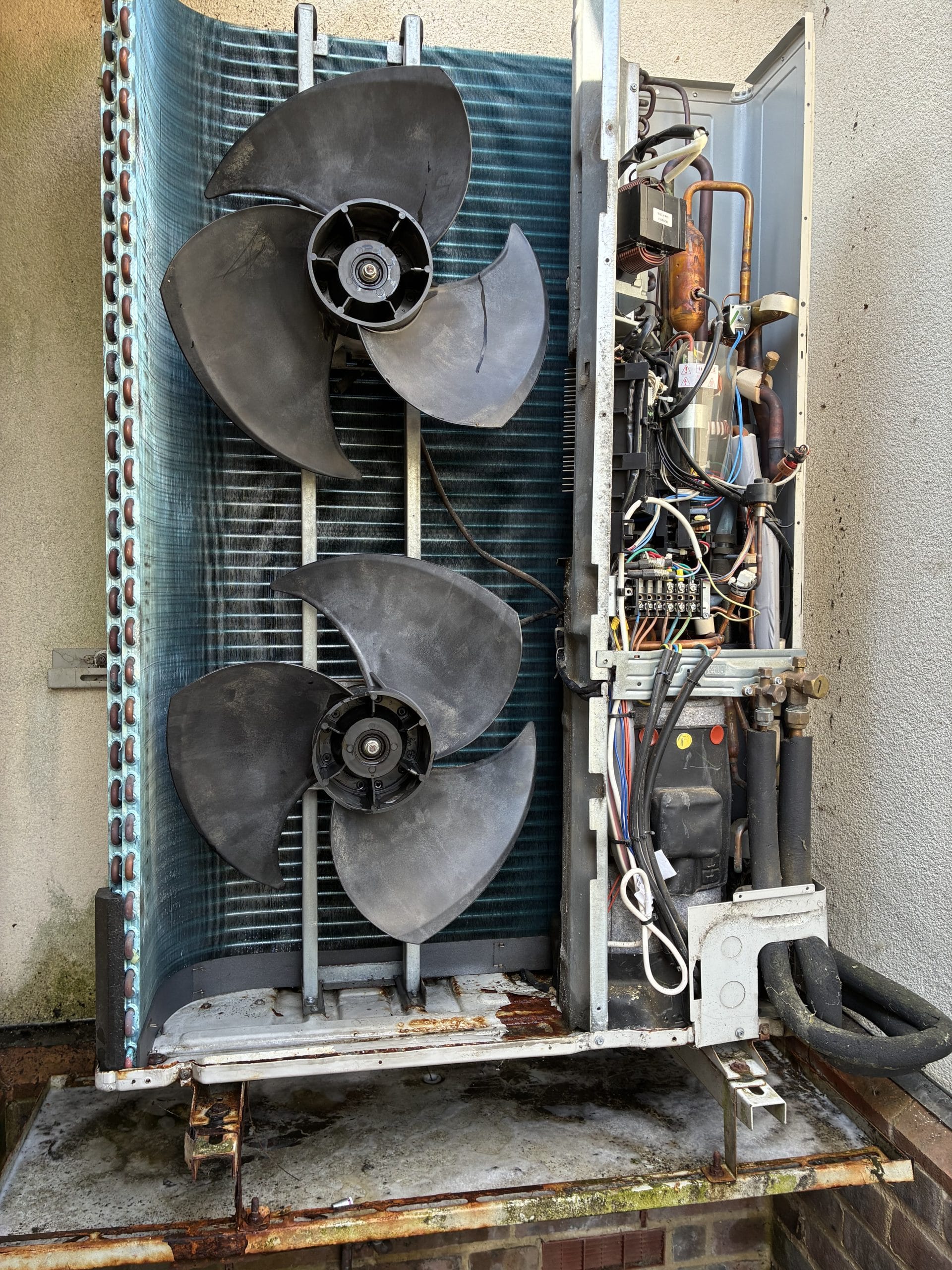 Air conditioning outdoor unit being serviced and inspected in Kent